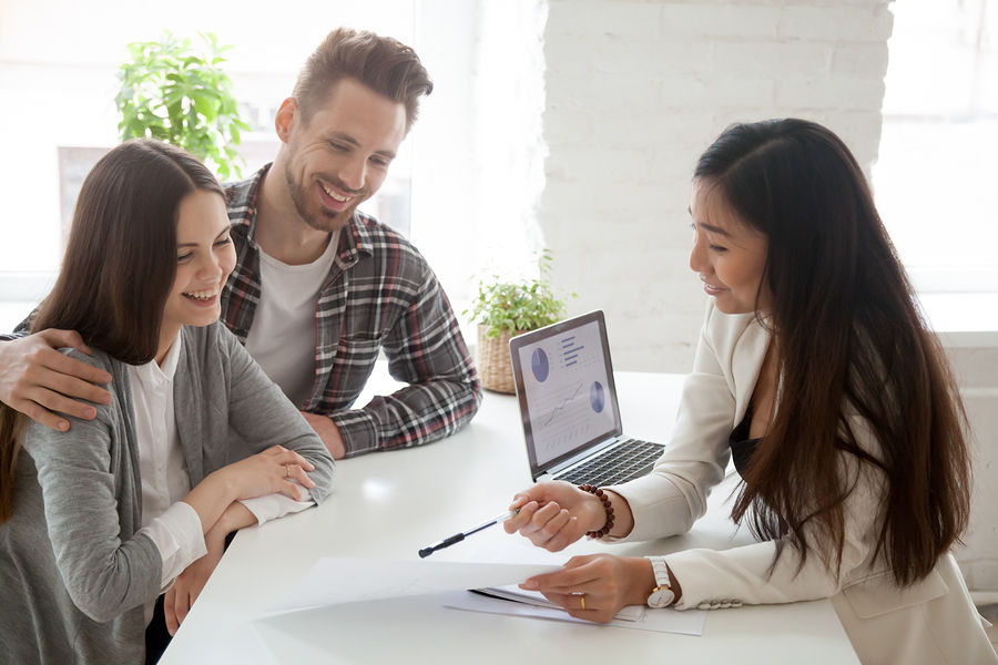 Asian Woman Realtor, Insurance Broker Or Financial Advisor Consulting Young Millennial Couple Client